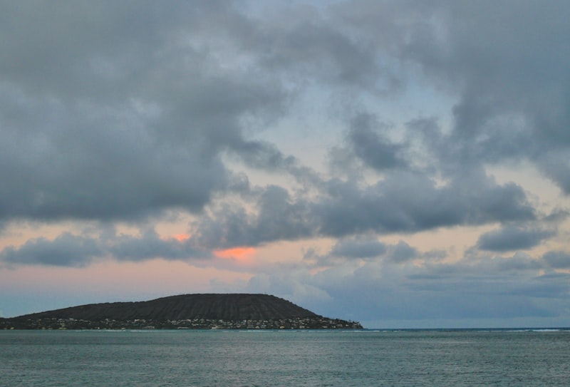 a large body of water under a cloudy sky